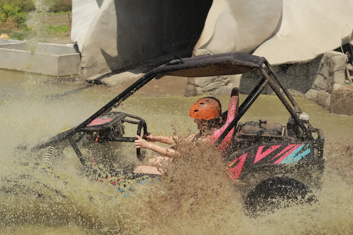 Single buggy rider tackling water splash